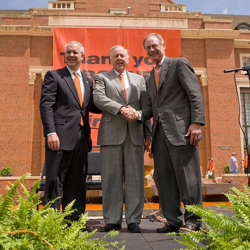 burns hargis shakes hand with Boone Pickens after gift announcement