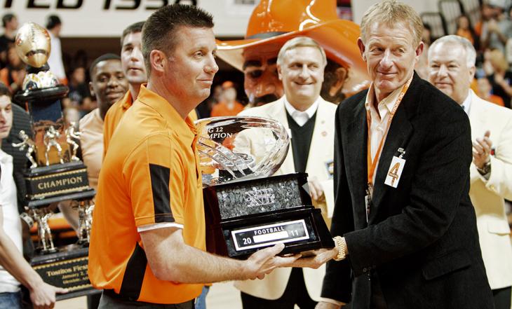 Gundy and Holder hold big 12 trophy