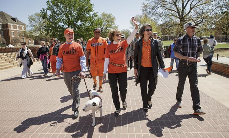 Burns, Ann and Scruff go for a walk around campus