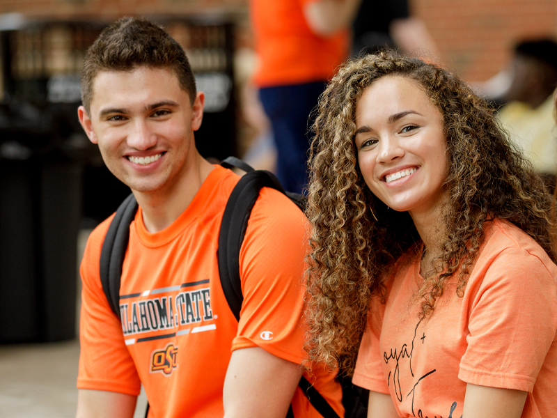Two OSU Students enjoying an event on the Stillwater campus.
