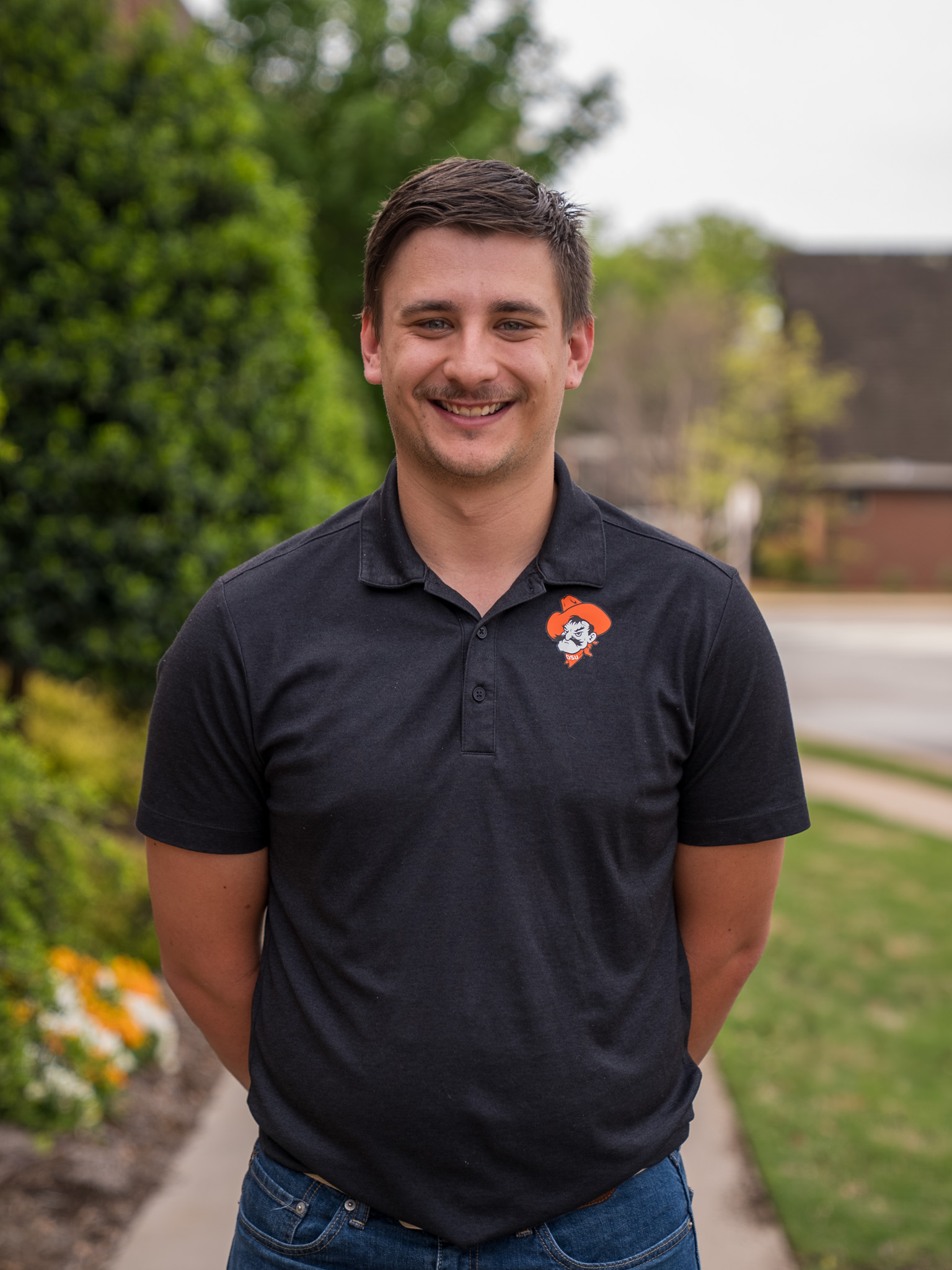 student standing in front of the library