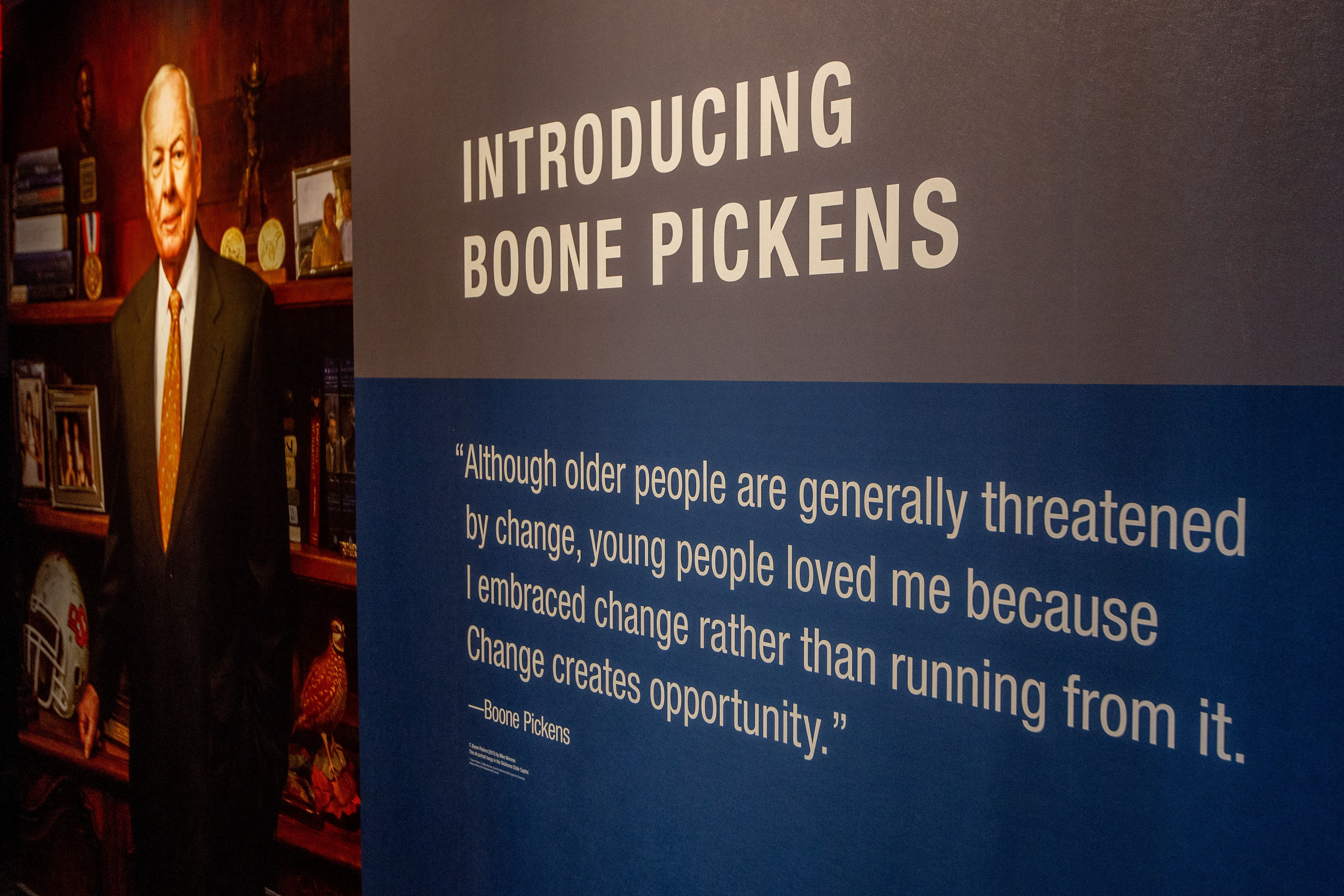 A closeup of a feature wall at the experience reading: "introducing Boone Pickens" that includes a quote from Boone Pickens just below it.