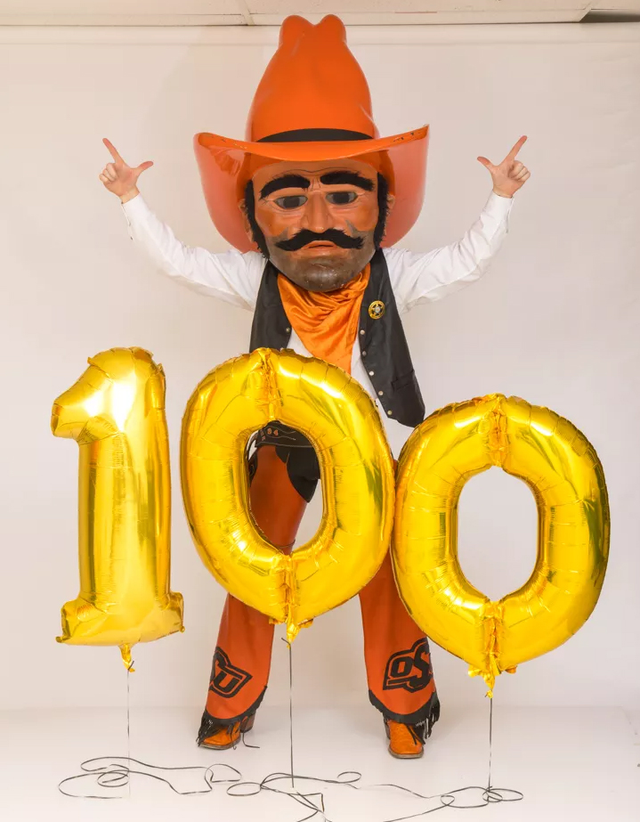 Pistol Pete with balloons that read 100