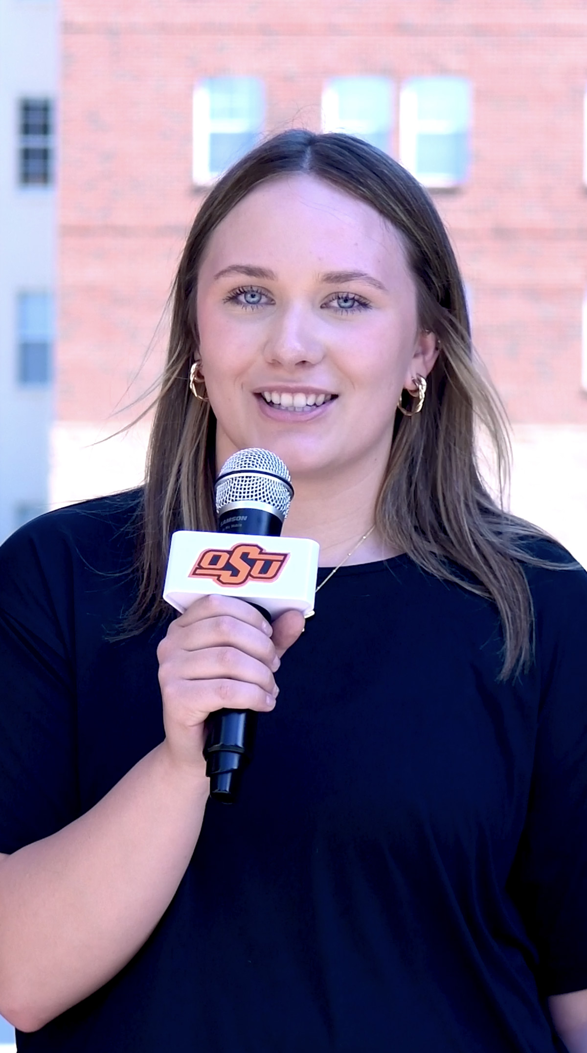 A student holding a microphone