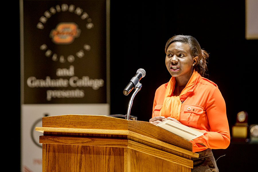 A graduate student speaks during one of the three-minute competitions.