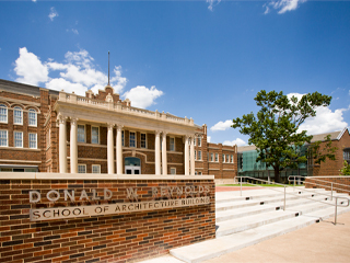 Architecture student works on scaled model of building