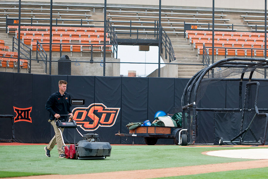 Student mowing turf at OSU's Allie P. Reynolds Stadium